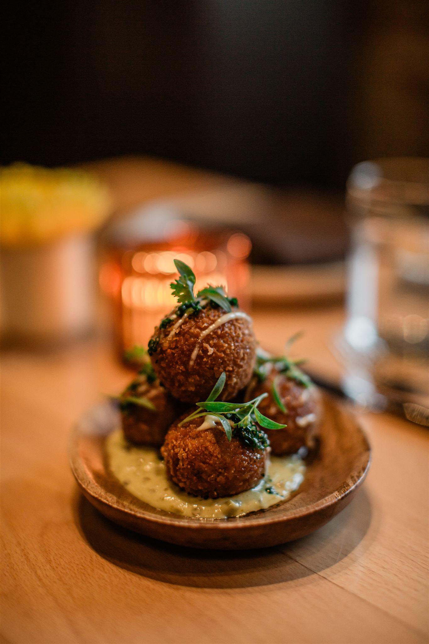 Fried croquettes plated on sauce